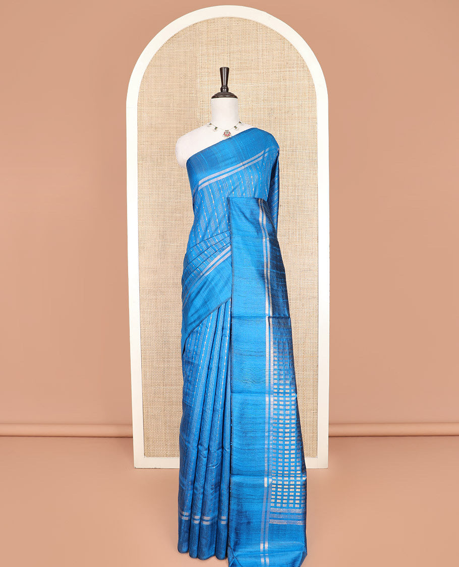 Blue Dupion Silk Saree, Beautified with Stripes All Over Its Body, Zari-Striped Border, Pallu Steeped with Dobby-Style Buttas, and Paired with a Matching Blouse