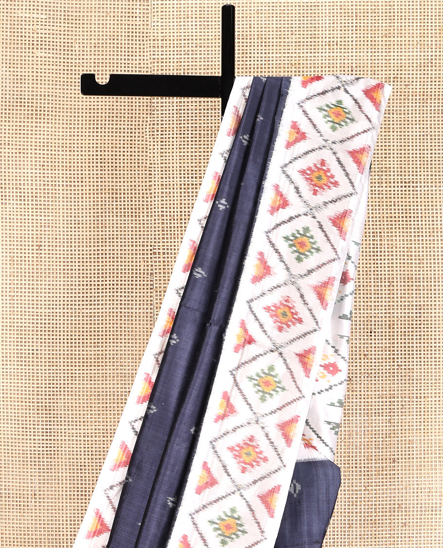 Grey Pochampally Ikat Silk Saree, Subtly Sparkled with Ikkat Buttas on Its Body, Complemented by a Contrast Diamond-Patterned Border, Pallu of Diamond-Patterns, and Paired with a Contrast Blouse
