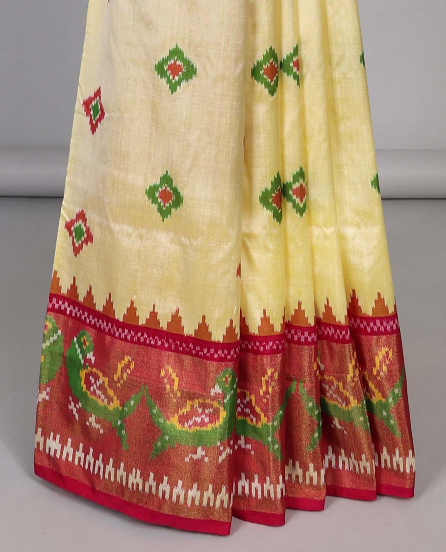 Yellow with motifs ikkat silk saree, contrast peacock border &  floral design pallu