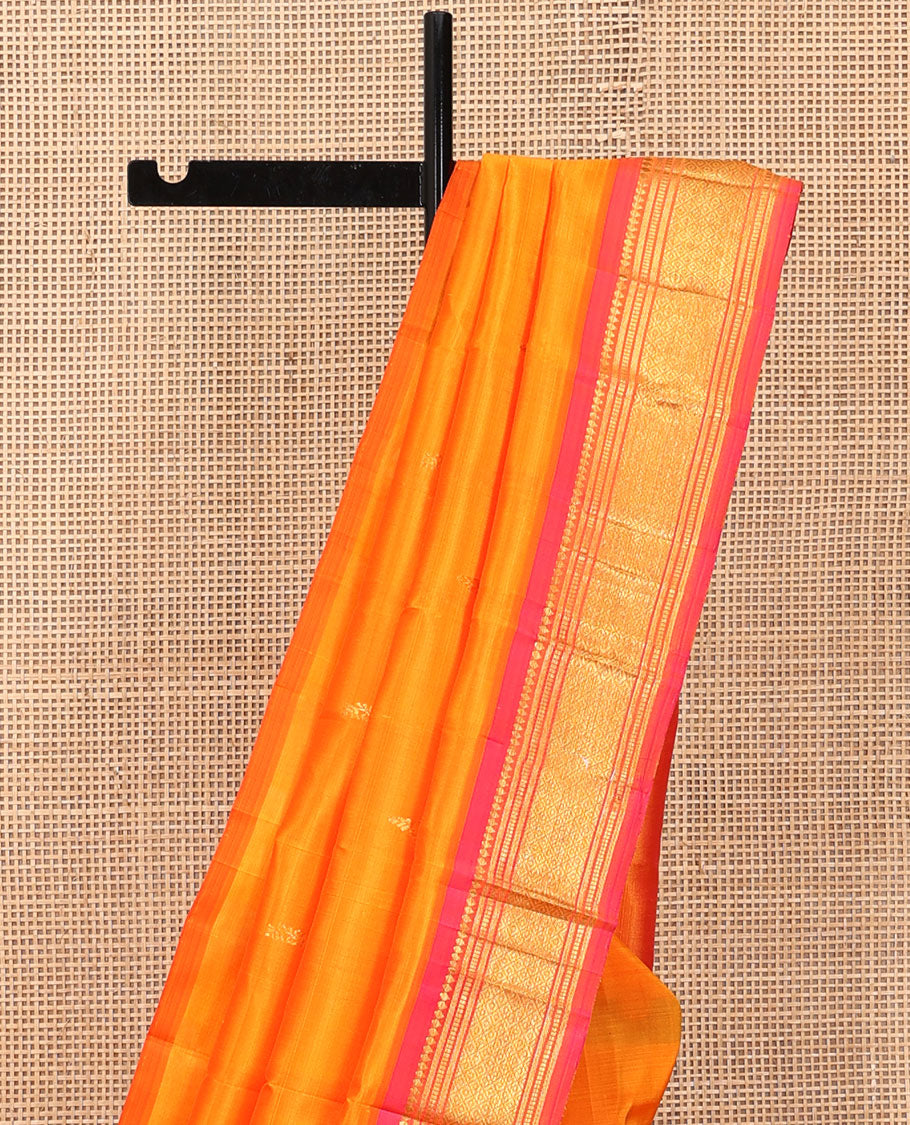Orange Kanchipuram Silk Saree, Woven with Zari Buttas, a Contrast One-Sided Border of Banaras, Muthu, and Mayil Kann Designs, a Zari Design Pallu, and No Blouse