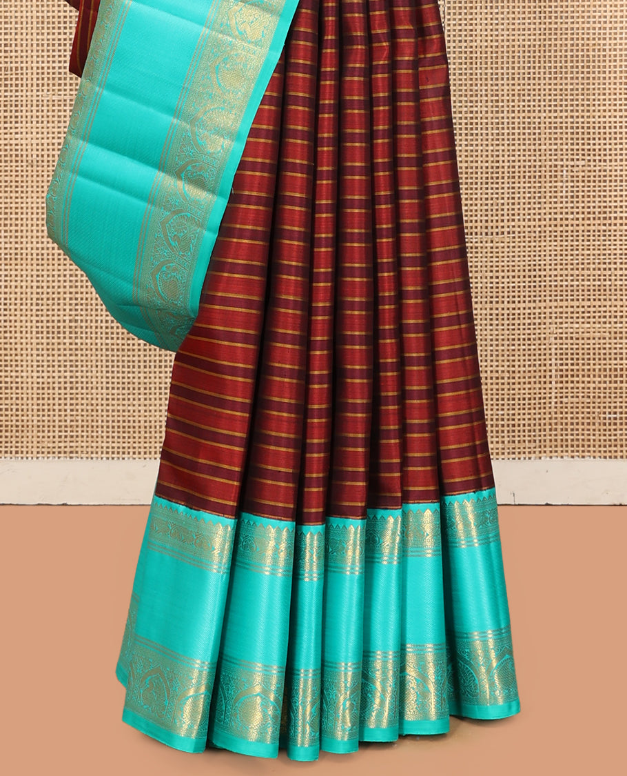 Brown Striped Kanchipuram Silk Saree, Complemented by a Contrast Border of Rekku, Muthu, Neli, Mayil, and Arumbu Manga Designs, Grand Pallu, and a Contrast Blouse
