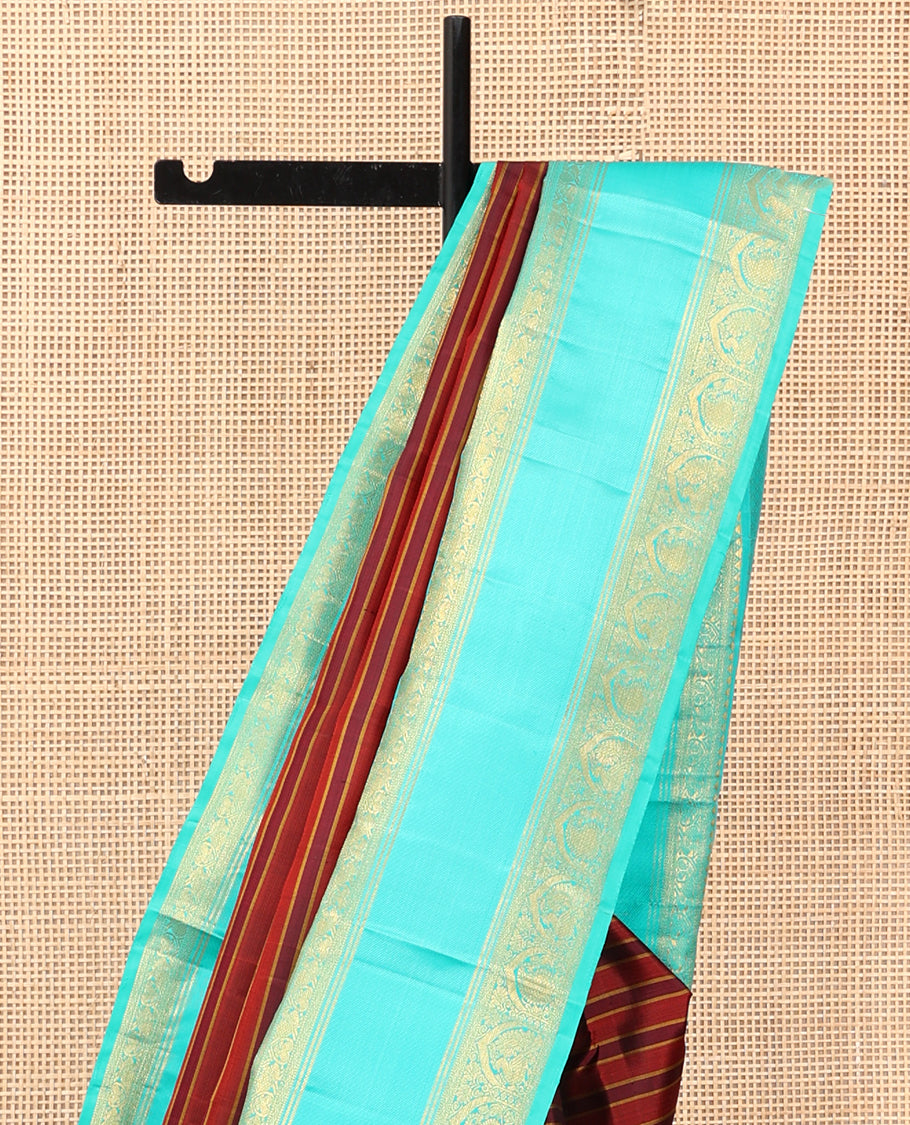 Brown Striped Kanchipuram Silk Saree, Complemented by a Contrast Border of Rekku, Muthu, Neli, Mayil, and Arumbu Manga Designs, Grand Pallu, and a Contrast Blouse