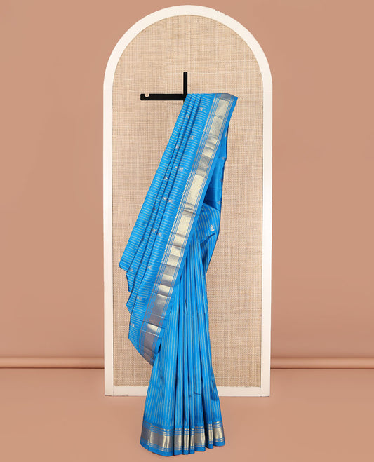 Blue Kanchipuram Silk Saree, Beautified with Zari Buttas and Stripes on Its Body, Highlighted by a Zari One-Sided Border of Panner Sombu, Banaras, and Jaal Designs, Pallu Features Zari Designs, and Comes Without a Blouse