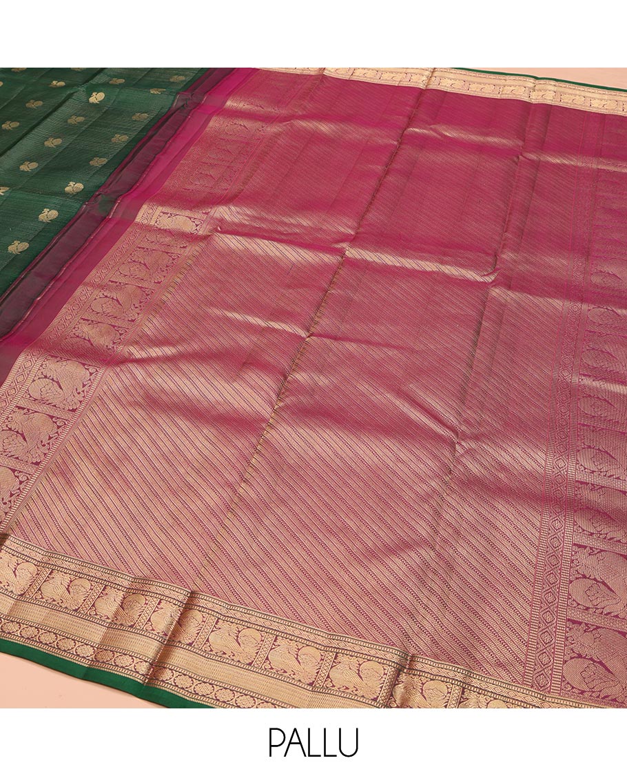 Green Kanchipuram Silk Saree, Beautified with Mayil Buttas and Zari Stripes on Its Body, Complemented by Contrast Border of Muthu, Diamond, Mayil, and Laddu Kamalam Designs, Diagonally Striped Pallu, and Paired with a Contrast Blouse