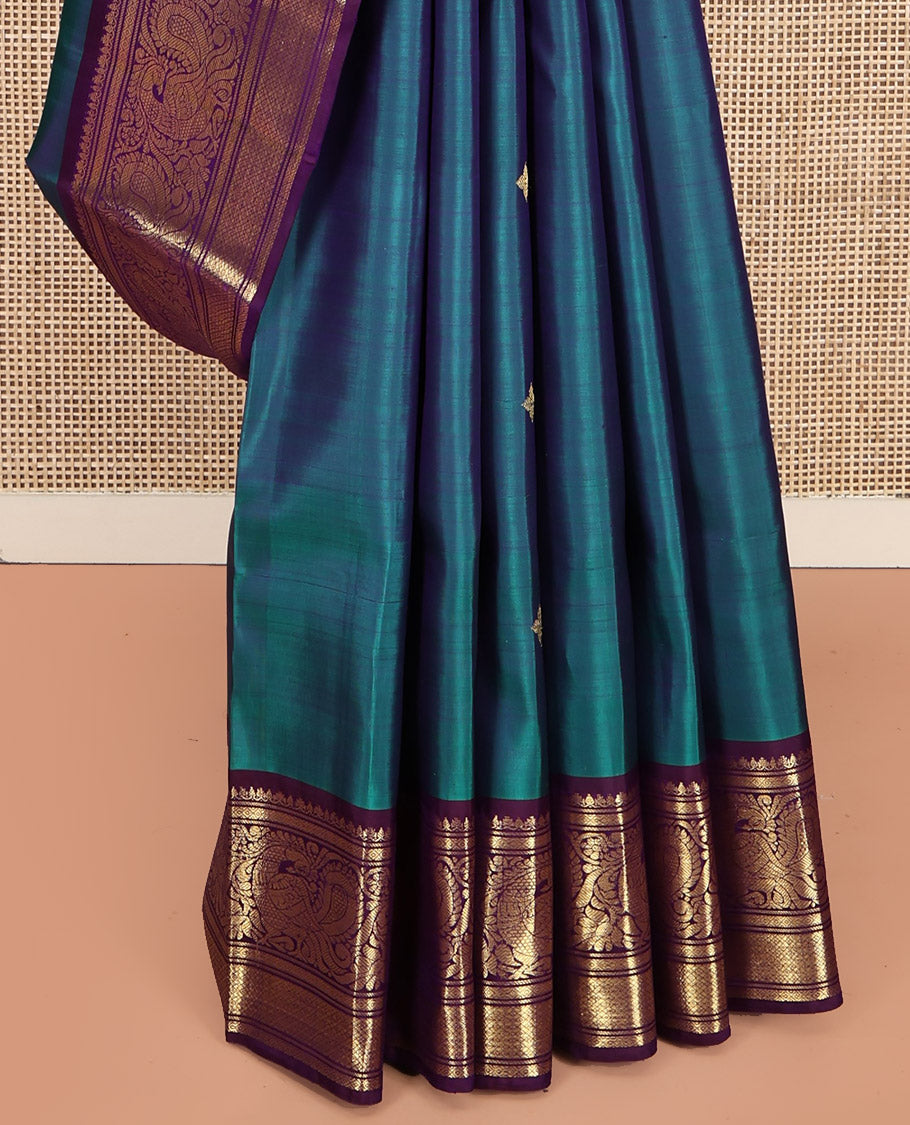 Blue Kanchipuram Silk Saree, Features Zari Buttas All Over Its Body, Complemented by a Contrast Border of Mayil Kann, Mayil, and Jaal Designs, Grand Jaal Pallu, and Paired with a Contrast Blouse