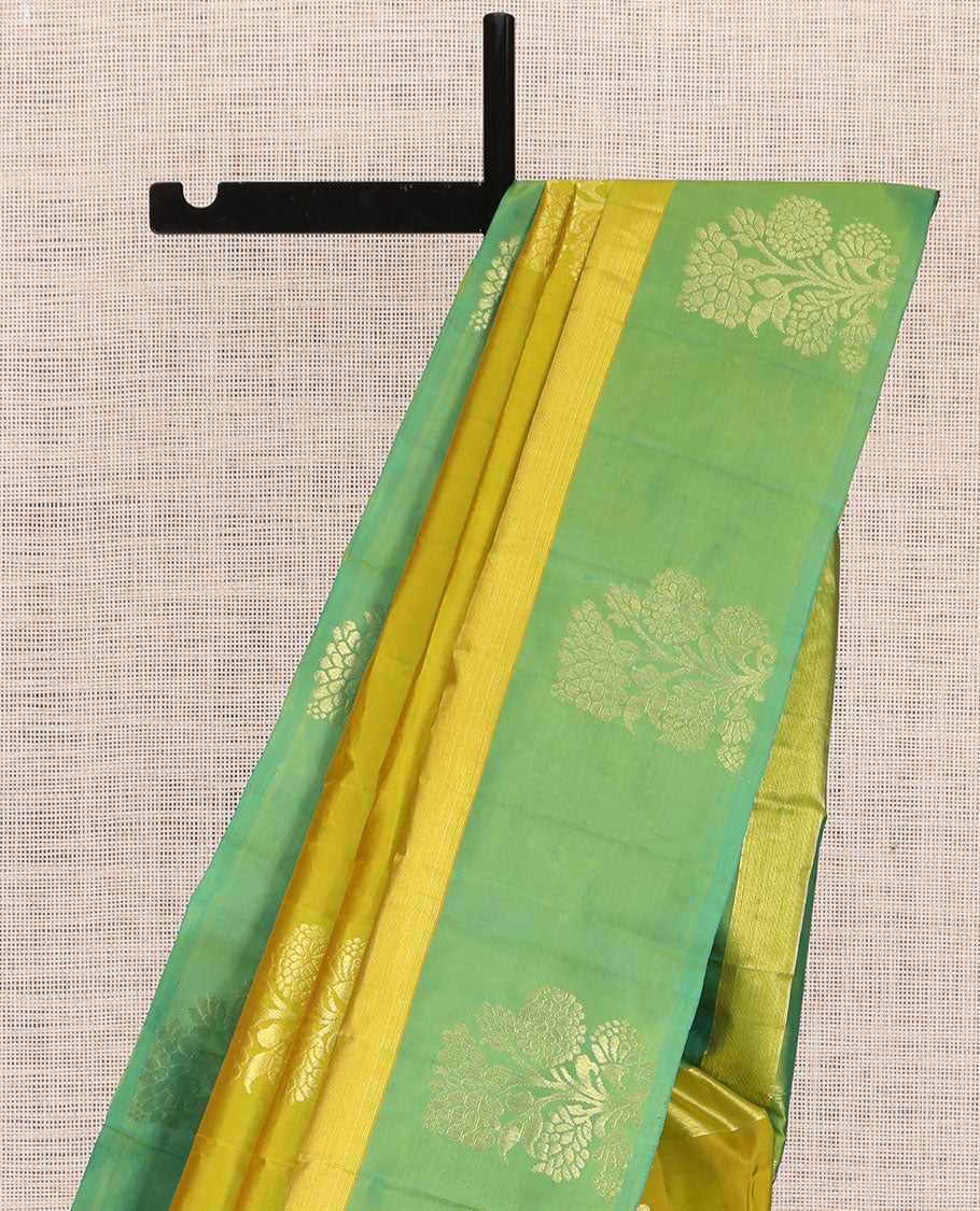 Green Kanchipuram Silk Saree, Woven with Floral Zari Buttas, a Contrast Floral Zari Design Border, Floral Design Pallu, and a Contrast Blouse