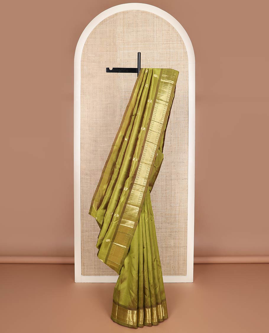 Green zari buttas kanchipuram silk saree, contrast one-sided border of mayil kann & laddu kamalam designs & zari woven pallu