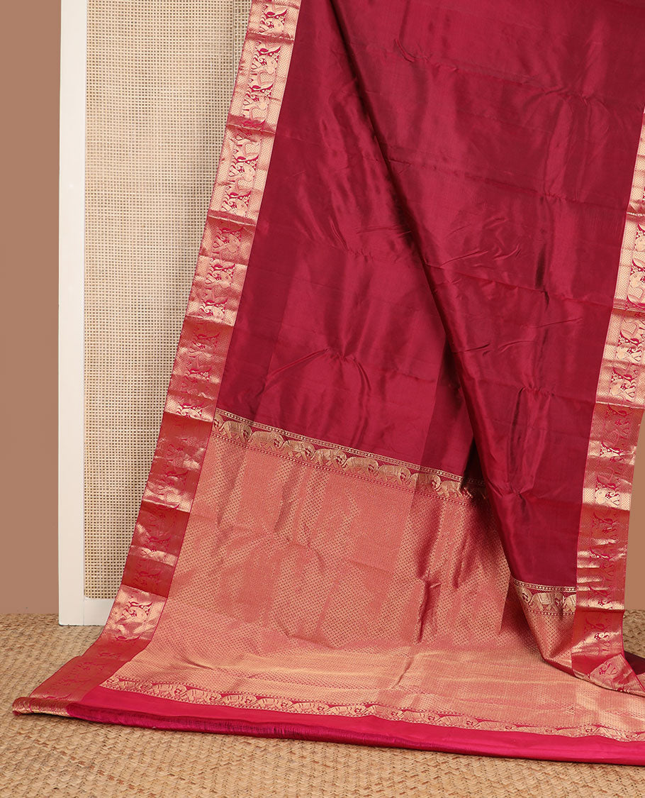 Crimson plain Kanchipuram silk saree, zari border of Muthu, mayil kann & yaanai designs & jaal pallu