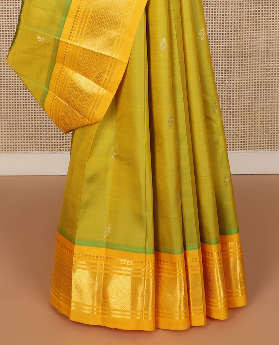 Green buttas Kanchipuram silk saree, contrast border of panner sombu, banaras & jaal design & floral design pallu