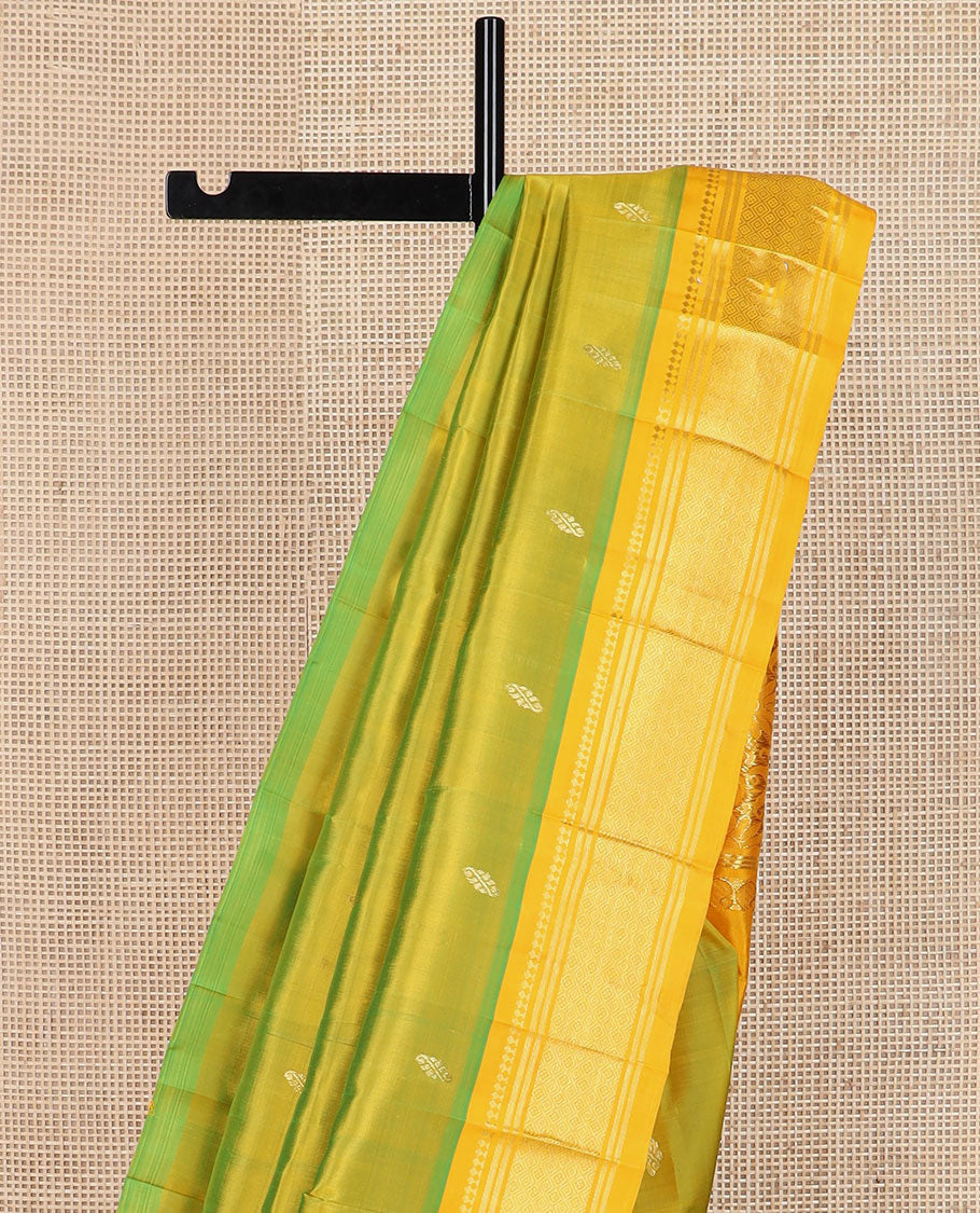 Green buttas Kanchipuram silk saree, contrast border of panner sombu, banaras & jaal design & floral design pallu