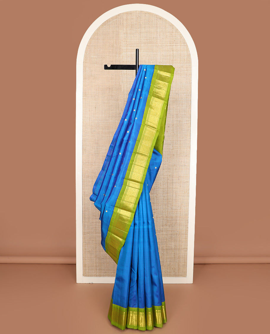 Blue zari buttas Kanchipuram silk saree, contrast one-sided korvai border of salngai, banaras and jaal design, and zari woven pallu
