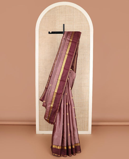 Pink annam chakram buttas Kanchipuram silk saree, contrast rettai pettu border of thilakam mokku, paisa, poo chakram and mayil designs, and jaal pallu