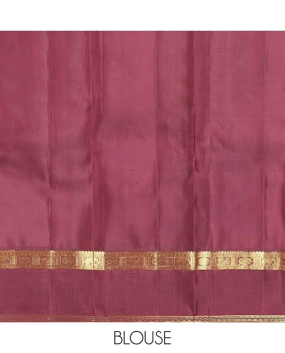 Pink annam chakram buttas Kanchipuram silk saree, contrast rettai pettu border of thilakam mokku, paisa, poo chakram and mayil designs, and jaal pallu