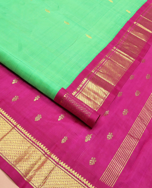 Green zari buttas Kanchipuram silk saree, contrast korvai border of thilakam mokku, banaras, and puli nagam designs, and zari design pallu