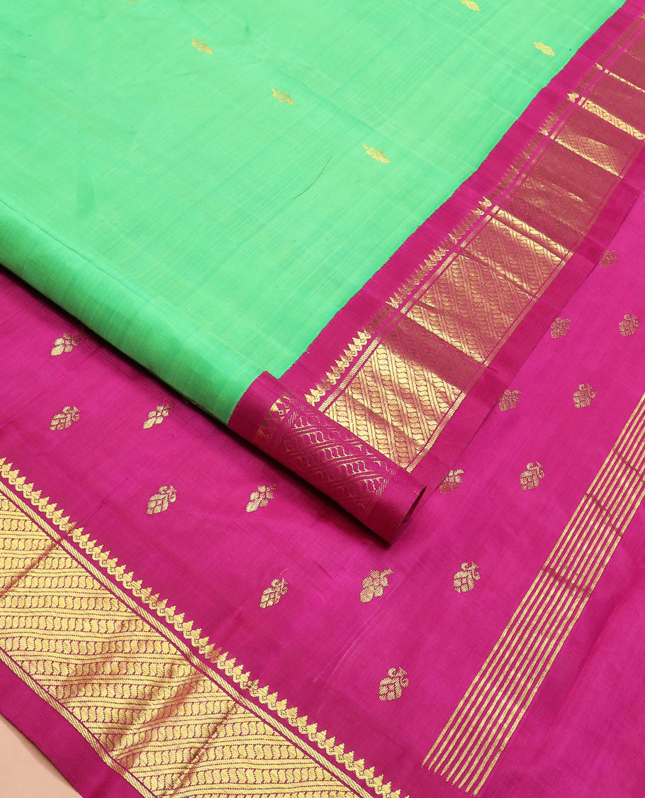 Green zari buttas Kanchipuram silk saree, contrast korvai border of thilakam mokku, banaras, and puli nagam designs, and zari design pallu