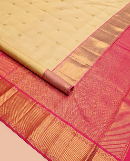 Gold mayil chakram buttas Kanchipuram silk saree, contrast border of thilakam mokku, muthu, banaras, and rudraksham designs, and jaal pallu