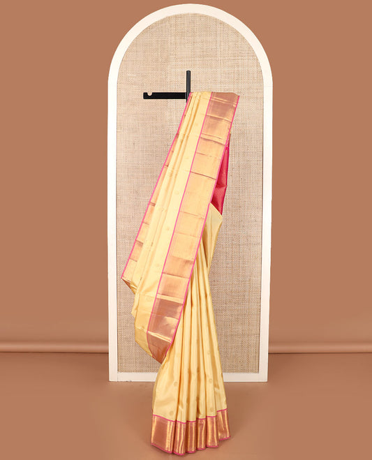 Gold mayil chakram buttas Kanchipuram silk saree, contrast border of thilakam mokku, muthu, banaras, and rudraksham designs, and jaal pallu