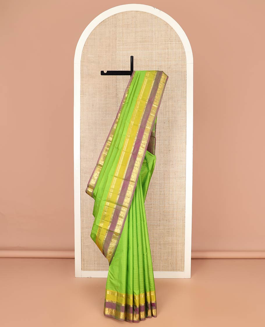 Green Kanchipuram Silk Saree Adorned with Vazhaipoo Stripes, Complemented by Contrast Rettai Pettu Border of Thilakam Mokku, Rudraksham, and Mayil Designs, Zari Woven Pallu, and Paired with a Contrast Blouse