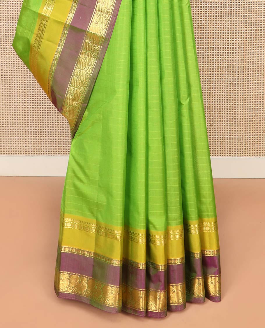 Green Kanchipuram Silk Saree Adorned with Vazhaipoo Stripes, Complemented by Contrast Rettai Pettu Border of Thilakam Mokku, Rudraksham, and Mayil Designs, Zari Woven Pallu, and Paired with a Contrast Blouse