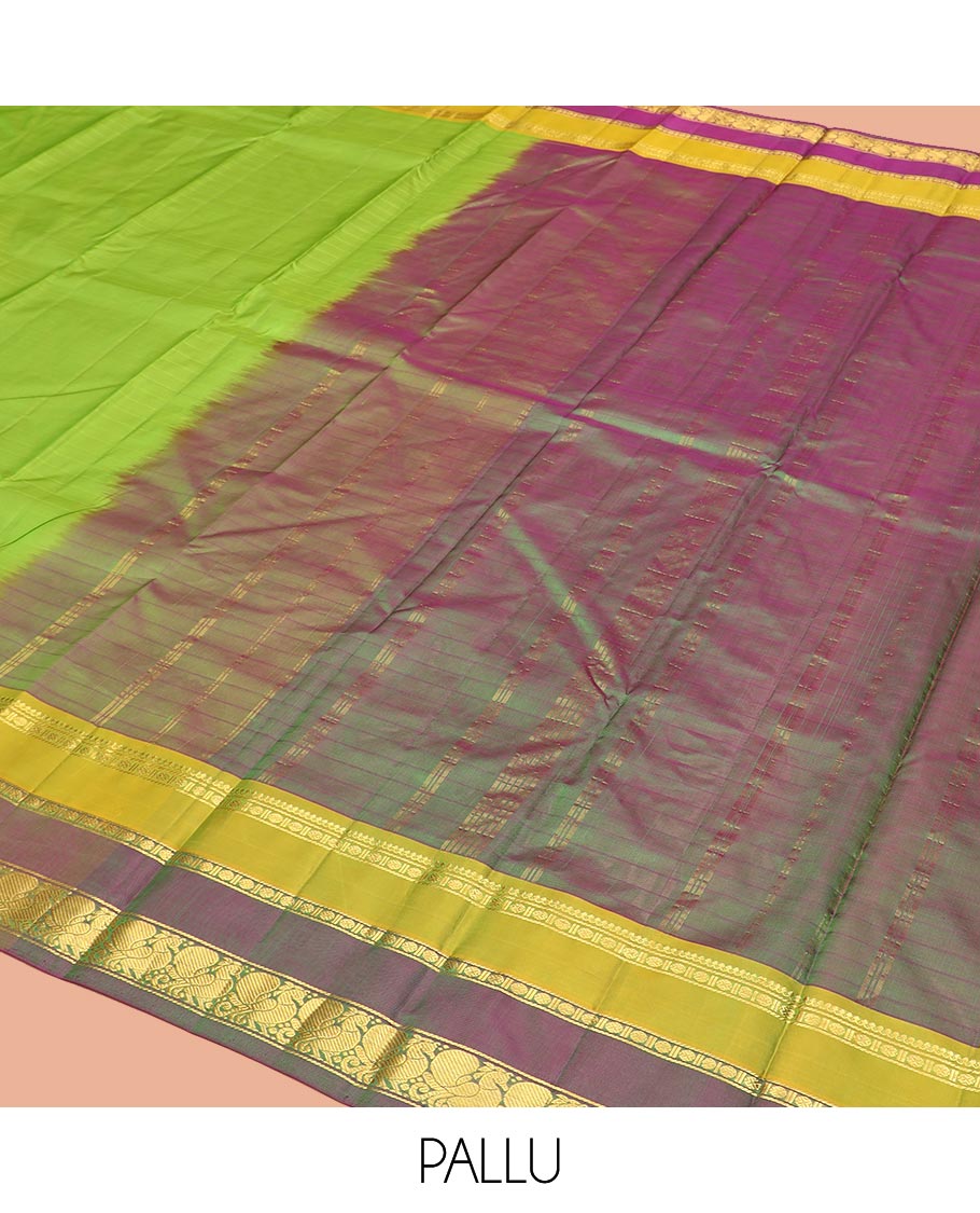 Green Kanchipuram Silk Saree Adorned with Vazhaipoo Stripes, Complemented by Contrast Rettai Pettu Border of Thilakam Mokku, Rudraksham, and Mayil Designs, Zari Woven Pallu, and Paired with a Contrast Blouse