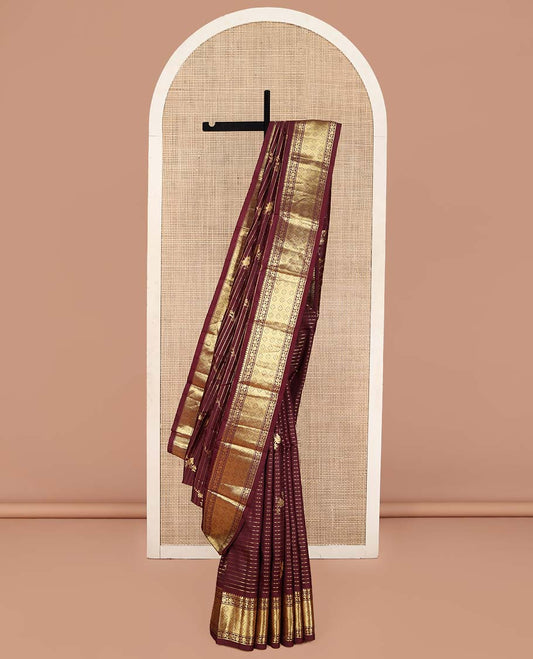 Maroon Kanchipuram Silk Saree, Gleamed Up with Zari Stripes and Bird Buttas on Its Body, Highlighted by a One-Sided Border of Kodi Visiry, and Jaal Designs, Pallu of Geometric Designs, and Comes Without a Blouse