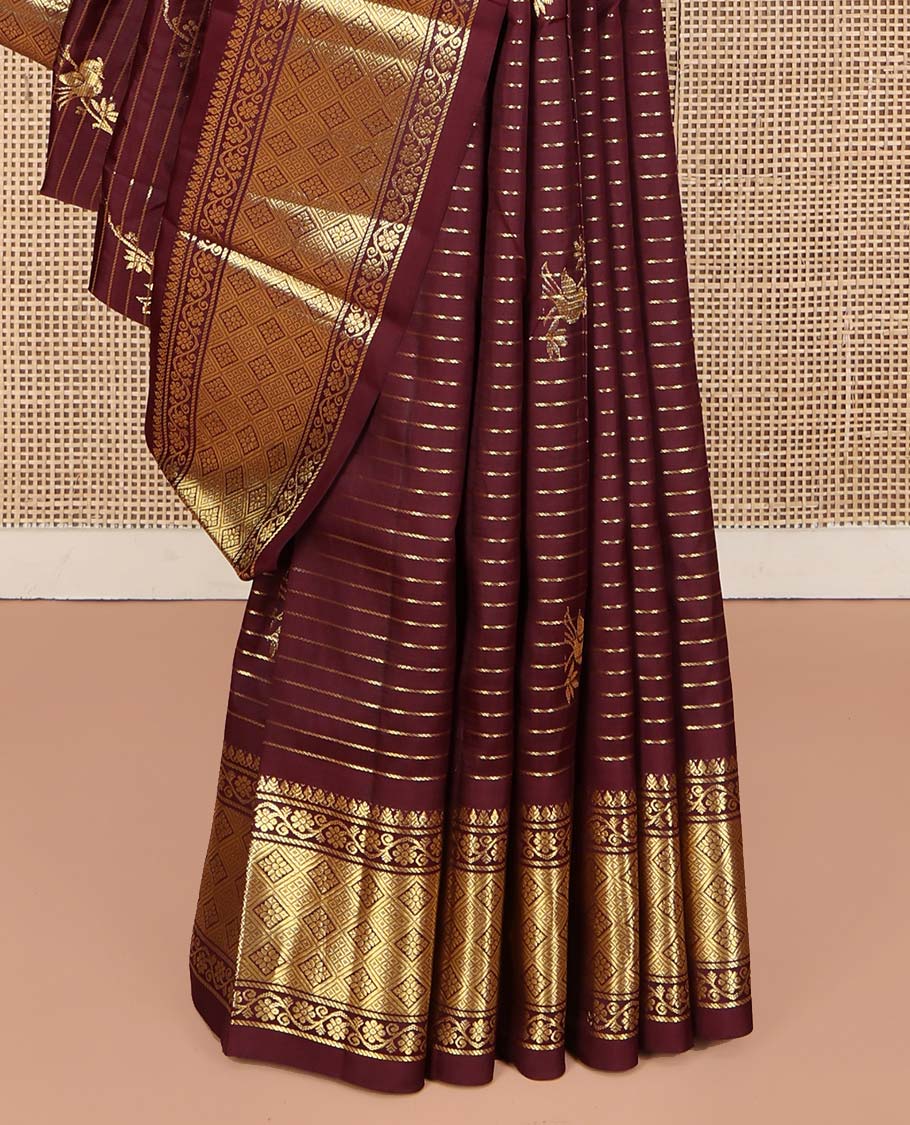 Maroon Kanchipuram Silk Saree, Gleamed Up with Zari Stripes and Bird Buttas on Its Body, Highlighted by a One-Sided Border of Kodi Visiry, and Jaal Designs, Pallu of Geometric Designs, and Comes Without a Blouse