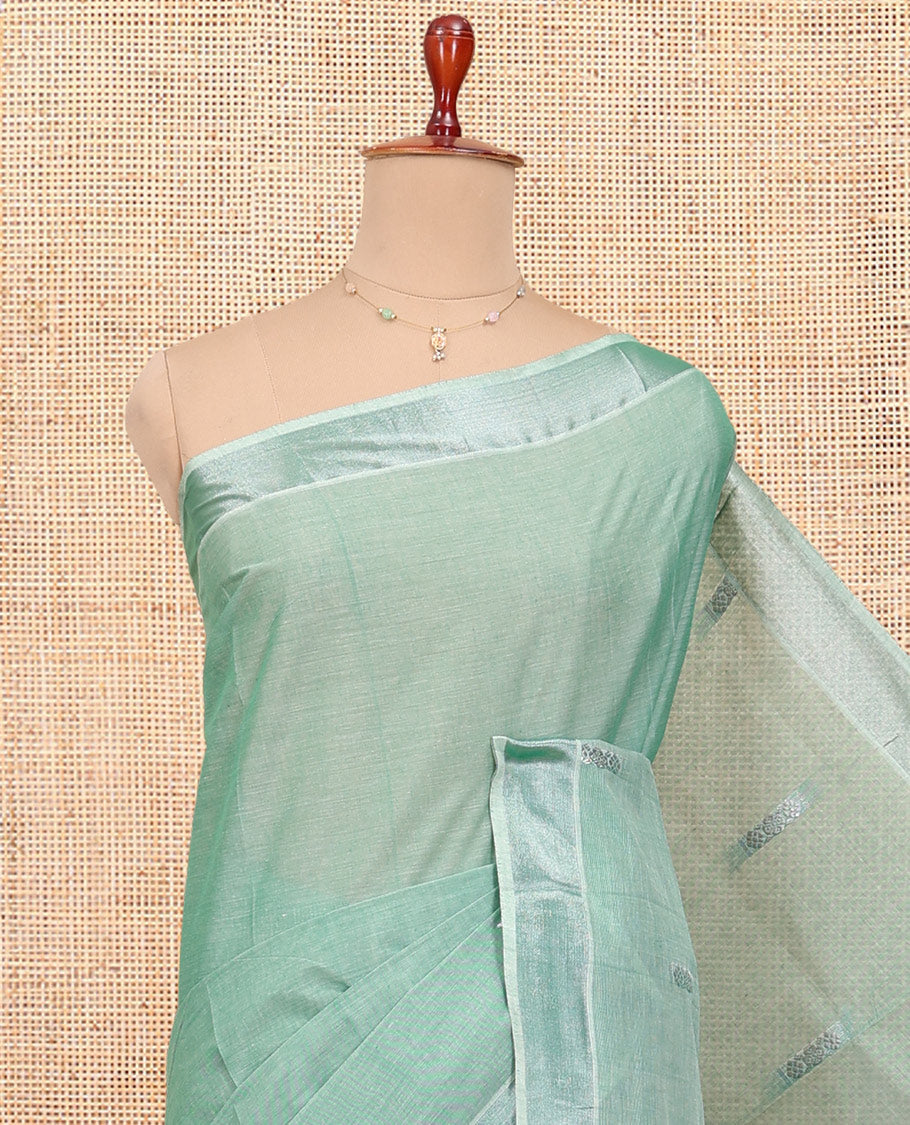 Green Kerala Cotton Saree, Woven with Buttas All Over Its Body, a Zari Bavanji Border, Pallu of Intricate Designs, and Paired with a Matching Blouse