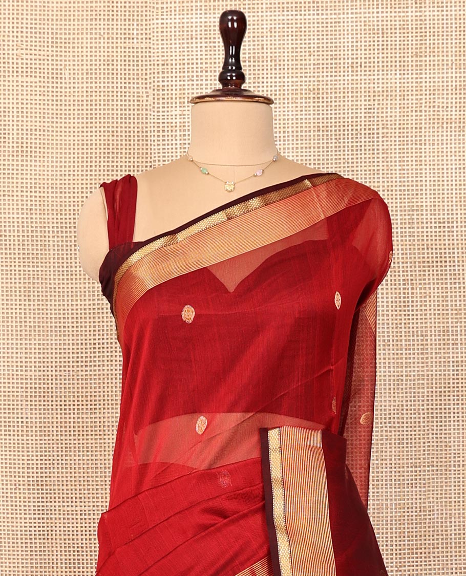 Red Maheshwari Cotton Saree, Ornamented with Zari Buttas on Its Body, Highlighted by Traditional Zari Border, Scintillating Pallu Steeped with Zari Stripes, and Paired with a Matching Blouse