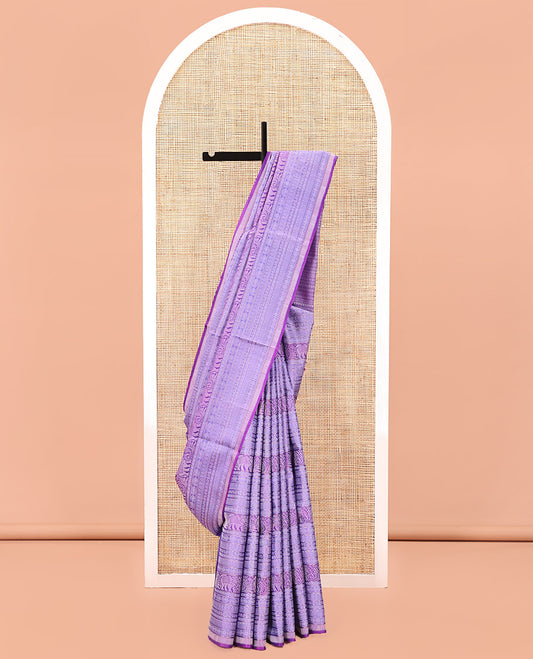 Lavender Mayuri Soft Silk Saree, Meticulously Crafted with Traditional Motifs in Embossed Weave, Subtle Border, Pallu of Geometric Patterns, and Paired with a Matching Blouse