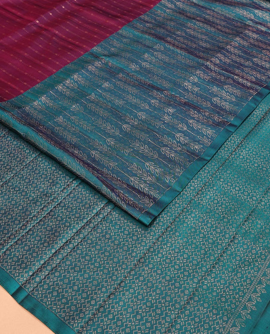 Maroon Mayuri Soft Silk Saree Elegantly Highlighted with Zari Stripes All Over Its Body, Highlighted by a Contrast Border of Leaf Vine Patterns, Majestically Detailed Pallu, and Paired with a Contrast Blouse