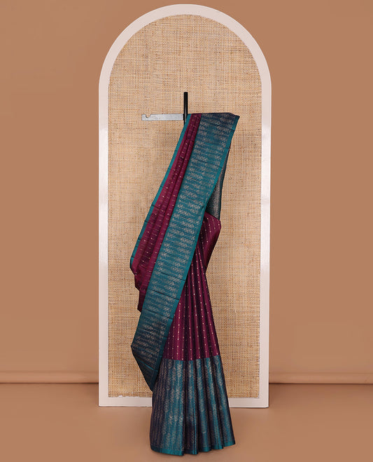 Maroon Mayuri Soft Silk Saree Elegantly Highlighted with Zari Stripes All Over Its Body, Highlighted by a Contrast Border of Leaf Vine Patterns, Majestically Detailed Pallu, and Paired with a Contrast Blouse