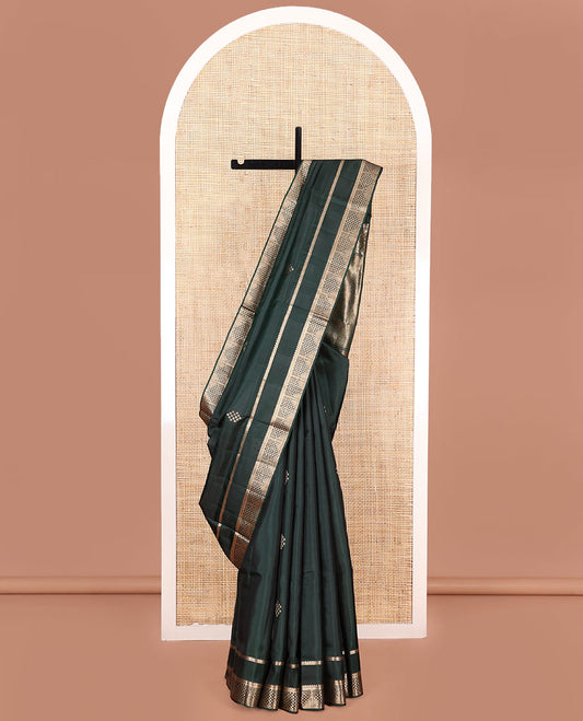 Green Mayuri Soft Silk Saree, Ornamented with Zari Buttas on Its Body, Highlighted by Zari Rettai Pettu Border of Thilakam Mokku, and Geometric Designs, Scintillating Pallu of Geometric Designs, and Paired with Matching Blouse