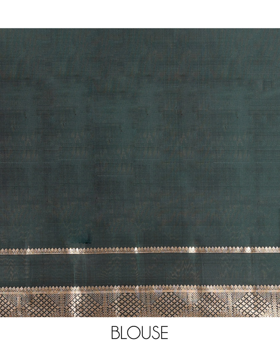 Green Mayuri Soft Silk Saree, Ornamented with Zari Buttas on Its Body, Highlighted by Zari Rettai Pettu Border of Thilakam Mokku, and Geometric Designs, Scintillating Pallu of Geometric Designs, and Paired with Matching Blouse