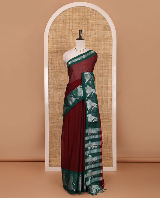 Maroon full-plain Mercerised cotton saree, contrast sliver zari Dancing Bharatanatyam girl motifs woven border, striped pallu & plain blouse