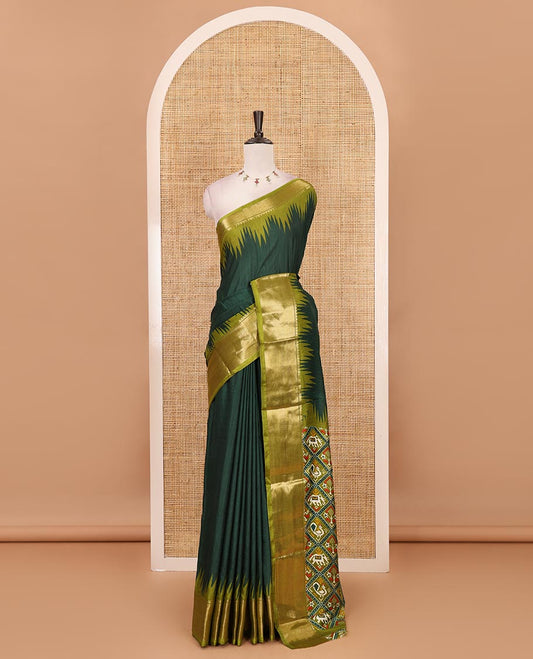 Green plain dola-tussar saree, contrast temple zari border, patola animal motifs enclosed jaal printed pallu & patola printed blouse
