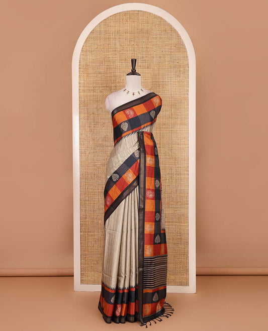 Chikku-black plain kathan silk saree, contrast buttas enclosed multi-color checked blocks border, temple pallu, and contrast blouse of checks, and buttas