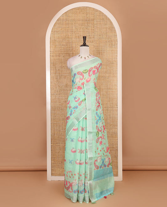 Apple green Pichwai Lotus, cow, and paisleys printed linen cotton saree, silver zari border, striped pallu and plain blouse