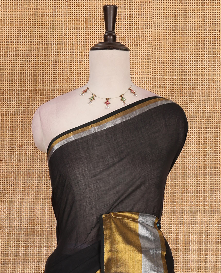 Inky black plain khadi mul cotton saree, contrast silver and golden bavanji border and matching zari border blouse