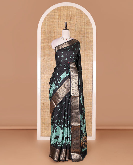 Black-Rama green dargon fly and cranes motifs printed dola silk saree, contrast gold zari border, Mughal floral printed pallu, and dragon fly printed blouse