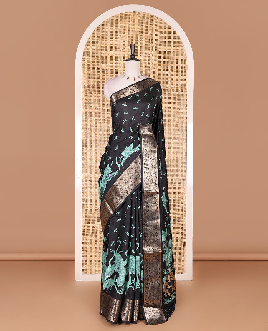 Black-Rama green dargon fly and cranes motifs printed dola silk saree, contrast gold zari border, Mughal floral printed pallu, and dragon fly printed blouse