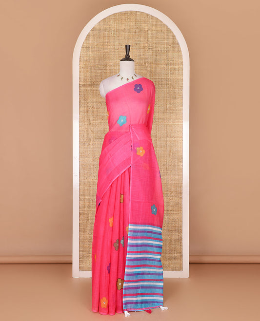 Borderless pink colorful five-petal flower motifs printed linen cotton saree, multi-color striped pallu, and contrast printed blouse