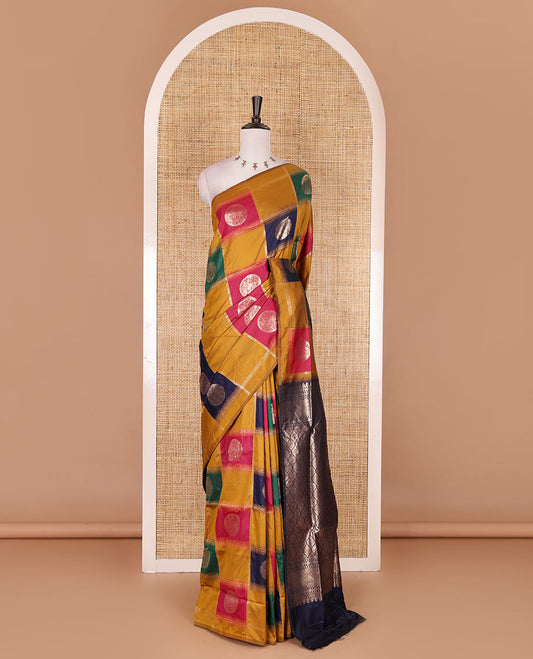 Borderless mustard chakra buttas enclosed, checked elite soft silk saree, contrast ogee patterned pallu, and contrast zari design blouse