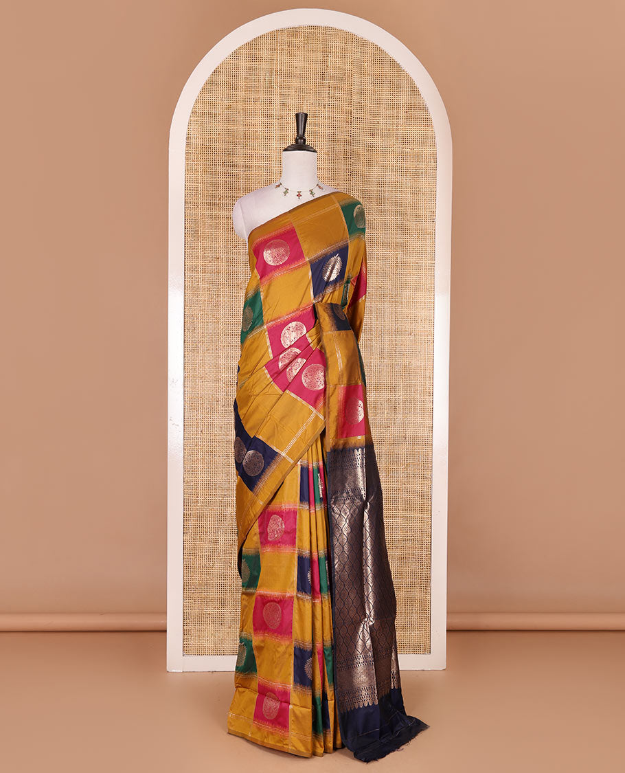 Borderless mustard chakra buttas enclosed, checked elite soft silk saree, contrast ogee patterned pallu, and contrast zari design blouse