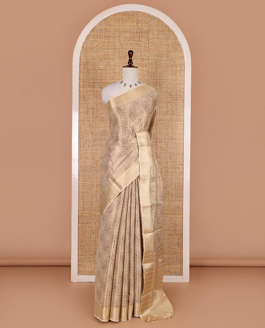 Chikku scallop design tissue saree, zari striped border, striped pallu, and gleaming matching blouse