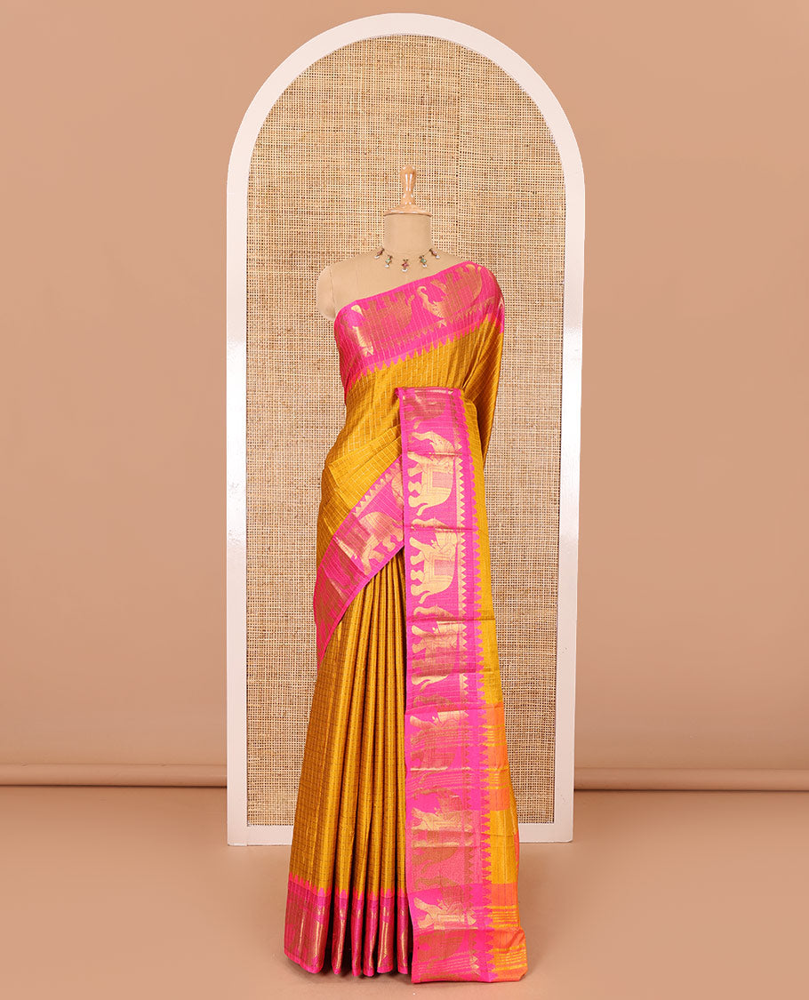 Mustard zari checked semi-taffeta saree, contrast satin temple border of elephant motifs, striped pallu, and a contrast striped blouse