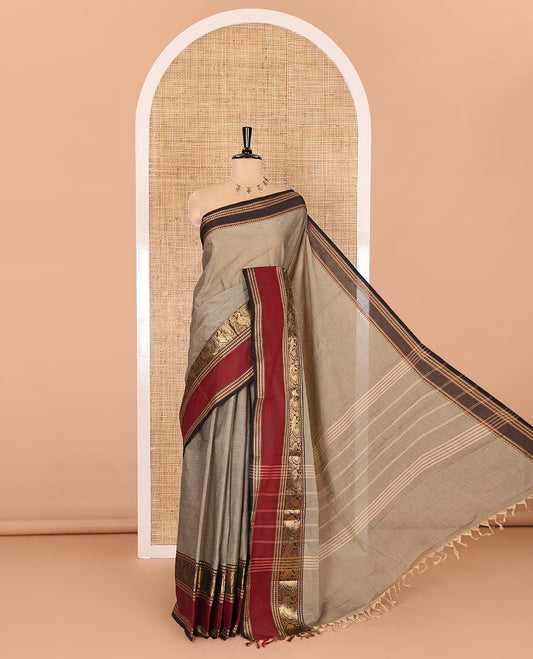 Beige plain Chettinad cotton saree, contrast rettai pettu peacock motifs border, striped pallu, and a matching blouse