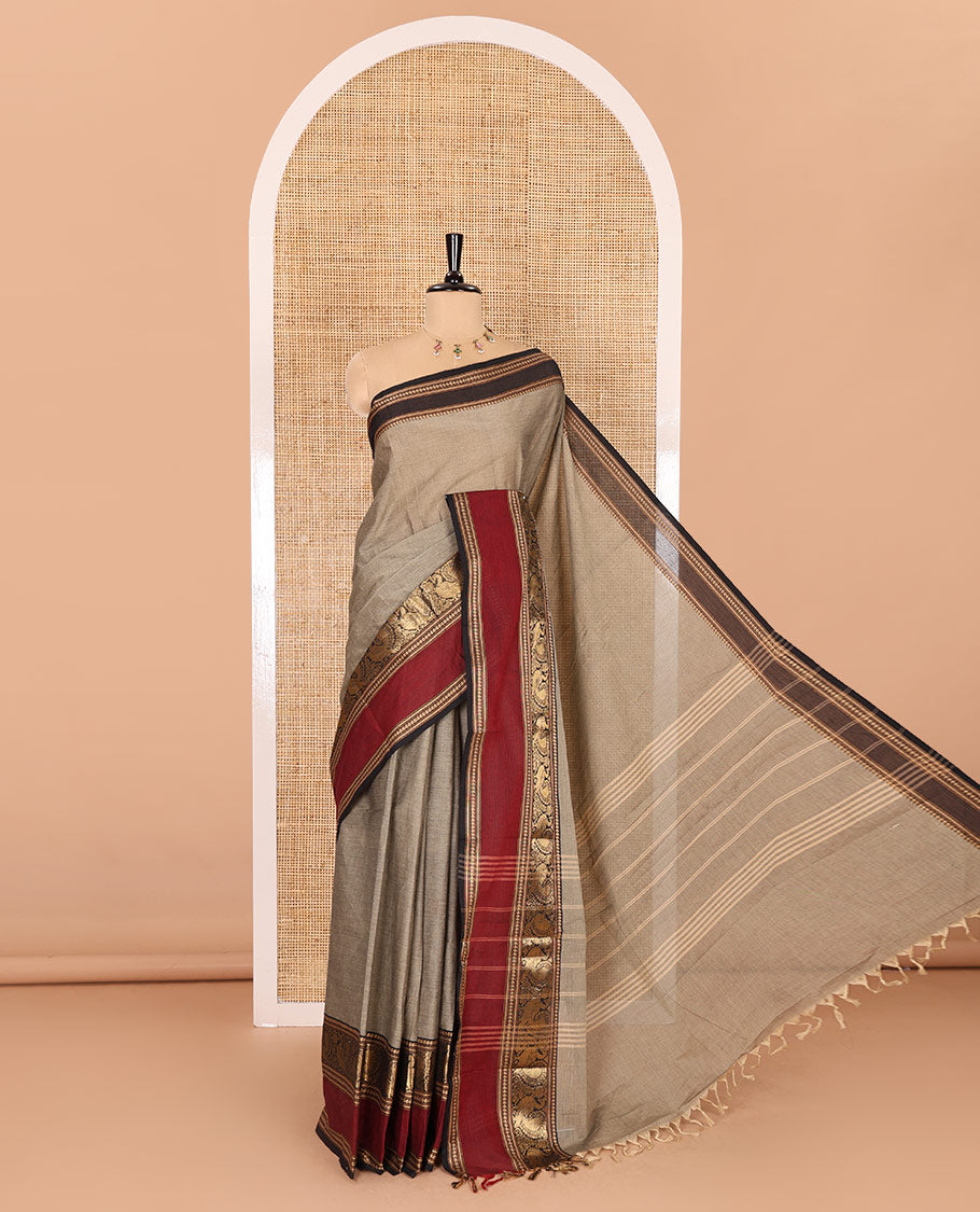 Beige plain Chettinad cotton saree, contrast rettai pettu peacock motifs border, striped pallu, and a matching blouse