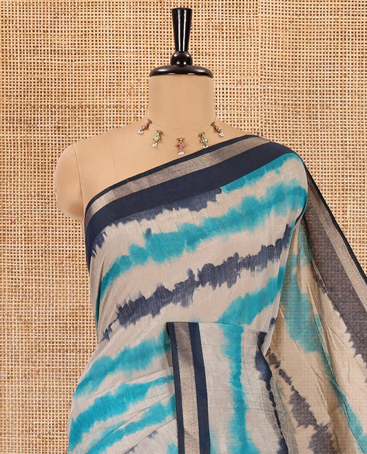 Navy blue shibori printed muslin cotton saree, contrast zari border, village theme printed pallu, and a contrast dots printed blouse