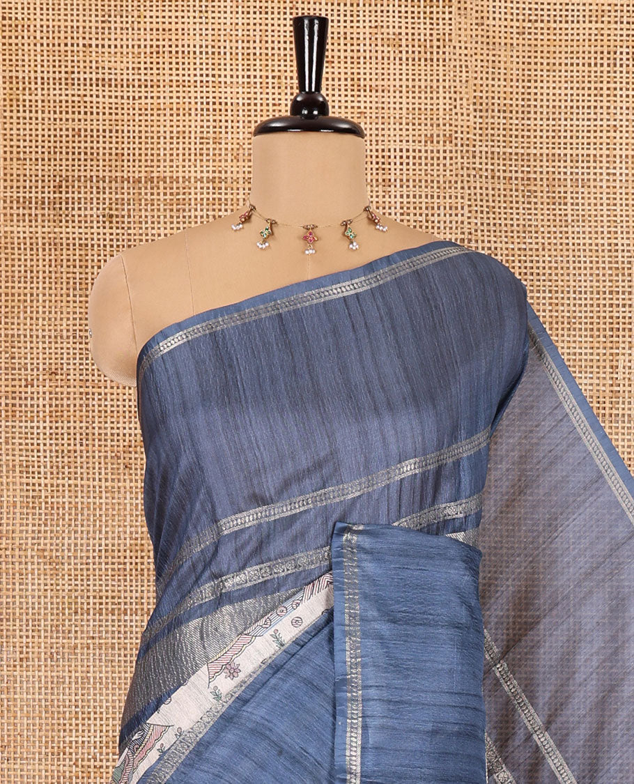 Grey Madhubani village theme printed moss crush saree, double-sided zari border, Madhubani village printed pallu, and a geometric buttas printed blouse