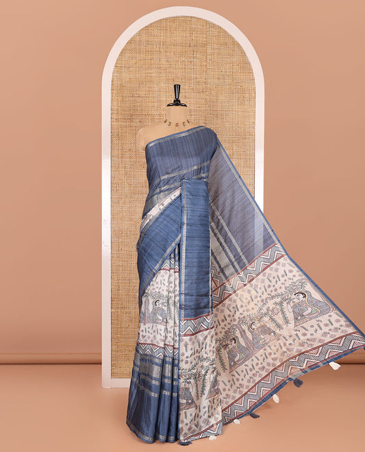 Grey Madhubani village theme printed moss crush saree, double-sided zari border, Madhubani village printed pallu, and a geometric buttas printed blouse